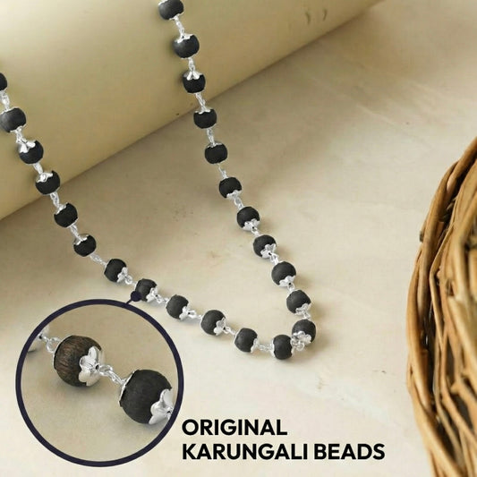 Karungali Mala silver capped beads close-up - genuine Tamil Nadu ebony wood